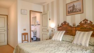Postel nebo postele na pokoji v ubytování Hotel Du Lac