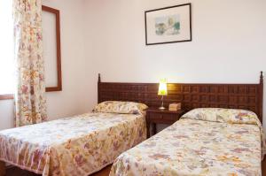מיטה או מיטות בחדר ב-Villa Solana