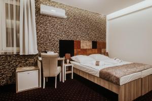 Postel nebo postele na pokoji v ubytování Hotel & Spa Meydan