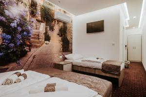 Postel nebo postele na pokoji v ubytování Hotel & Spa Meydan