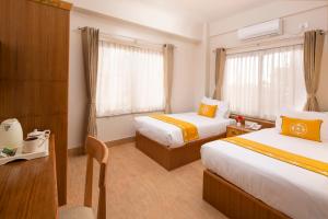 Letto o letti in una camera di Pema Boutique Hotel