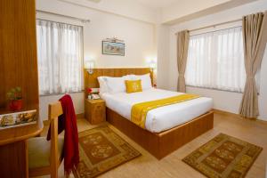 Letto o letti in una camera di Pema Boutique Hotel
