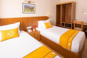 Letto o letti in una camera di Pema Boutique Hotel