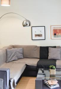 a living room with a couch and a table at Two bedroom apartment in Kesariani in Athens