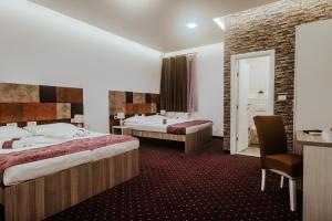 Postel nebo postele na pokoji v ubytování Hotel & Spa Meydan