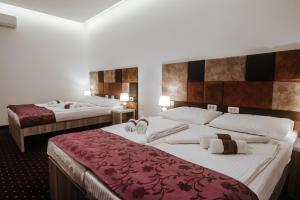 Postel nebo postele na pokoji v ubytování Hotel & Spa Meydan