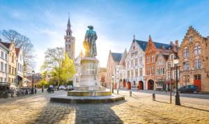 a statue in the middle of a city street at St Christopher's Inn Bruges - The Bauhaus in Bruges