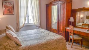 Postel nebo postele na pokoji v ubytování Hotel Du Lac
