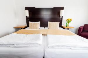 Łóżko lub łóżka w pokoju w obiekcie Parkhotel Plzen Congress Center