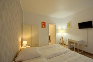 Ένα ή περισσότερα κρεβάτια σε δωμάτιο στο Neferprod Apartments - IS - CAM 02