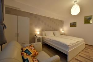En eller flere senger på et rom på Neferprod Apartments - IS - CAM 06