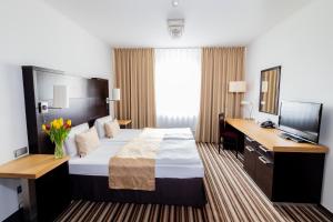 Łóżko lub łóżka w pokoju w obiekcie Parkhotel Plzen Congress Center