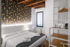 Posteľ alebo postele v izbe v ubytovaní Flats4Rent Casa di Tea