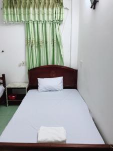 Giường trong phòng chung tại Homestay Minh Nguyên