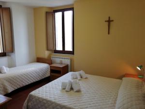 Casa per Ferie Ulivo d'Assisi客房内的一张或多张床位