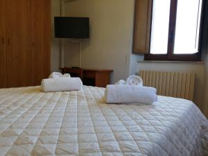 Casa per Ferie Ulivo d'Assisi客房内的一张或多张床位