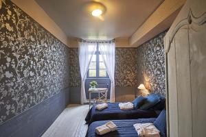 Postel nebo postele na pokoji v ubytování B&B Le Plessix - Manoir le Plessix Madeuc