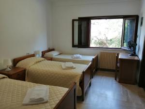 Casa per Ferie Ulivo d'Assisi客房内的一张或多张床位