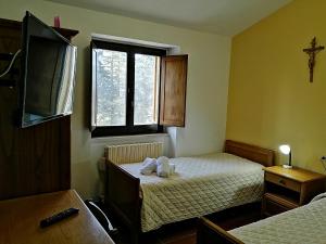 Casa per Ferie Ulivo d'Assisi客房内的一张或多张床位