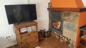 TV a/nebo společenská místnost v ubytování La Reserva