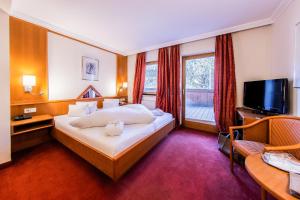 Posteľ alebo postele v izbe v ubytovaní Hotel Riederhof- Urlaub mit WAU!