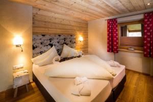 Posteľ alebo postele v izbe v ubytovaní Hotel Riederhof- Urlaub mit WAU!