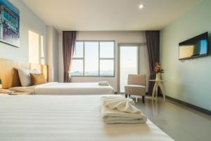 Postel nebo postele na pokoji v ubytování Vapa Hotel - SHA Extra Plus