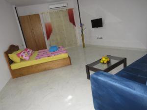 a living room with a bed and a couch at Apartment Sorrento near the sea RedSeaLine in Hurghada