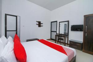 Tempat tidur dalam kamar di Delphin Hotel
