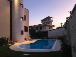 a swimming pool in the backyard of a house at ALBA SULLO STRETTO in Messina