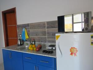 a kitchen with a sink and a refrigerator at Apartment Stella di Mari near the sea RedSeaLine in Hurghada
