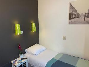 En eller flere senger på et rom på Hotel Oorsprongpark