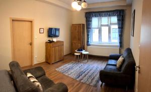 TV a/nebo společenská místnost v ubytování Liszt Apartman