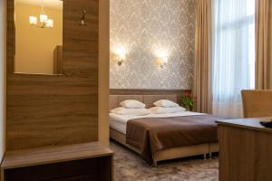 Posteľ alebo postele v izbe v ubytovaní Hotel Maximum