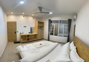 Postel nebo postele na pokoji v ubytování Dhonveli Inn, Bandidhoo