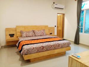 Postel nebo postele na pokoji v ubytování Dhonveli Inn, Bandidhoo