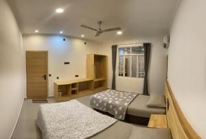Postel nebo postele na pokoji v ubytování Dhonveli Inn, Bandidhoo