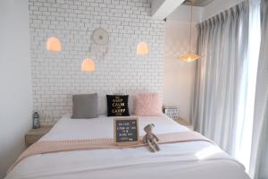 Postel nebo postele na pokoji v ubytování Bonne Nuit Hotel, Hua Hin