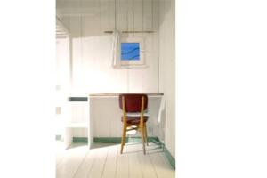 a chair sitting at a desk in a room at Logement Design à Loix-en-Ré - 2 étoiles - Centre Village in Loix