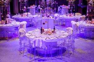 a group of white tables with chairs and bottles of wine at Mariënhage Boutique Hotel in Eindhoven