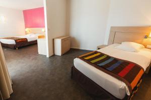 Postel nebo postele na pokoji v ubytování Esatitude Hotel
