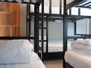 Postel nebo postele na pokoji v ubytování @HOsTEL PHANGAN
