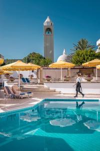 
The swimming pool at or near Mitsis Petit Palais Beach Hotel
