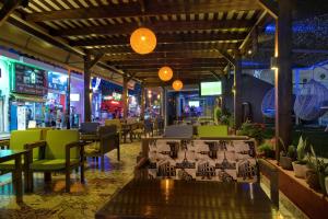a restaurant with tables and chairs and lights at Ilios 1 Central in Malia