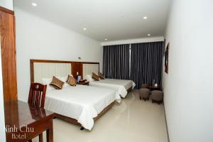 Giường trong phòng chung tại Ninh Chu Hotel