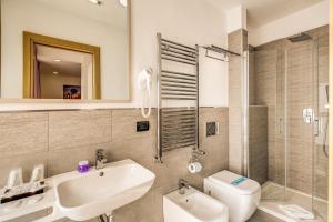 Koupelna v ubytování Ginevra Palace Hotel + 27 fotografií