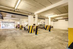a parking garage with cars parked in it at Ginevra Palace Hotel in Rome