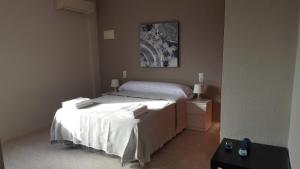 Postel nebo postele na pokoji v ubytování Hotel Castellverd