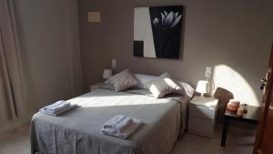 Postel nebo postele na pokoji v ubytování Hotel Castellverd