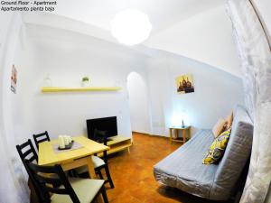 a living room with a couch and a table at Apartamentos Ester in Santa Cruz de Tenerife